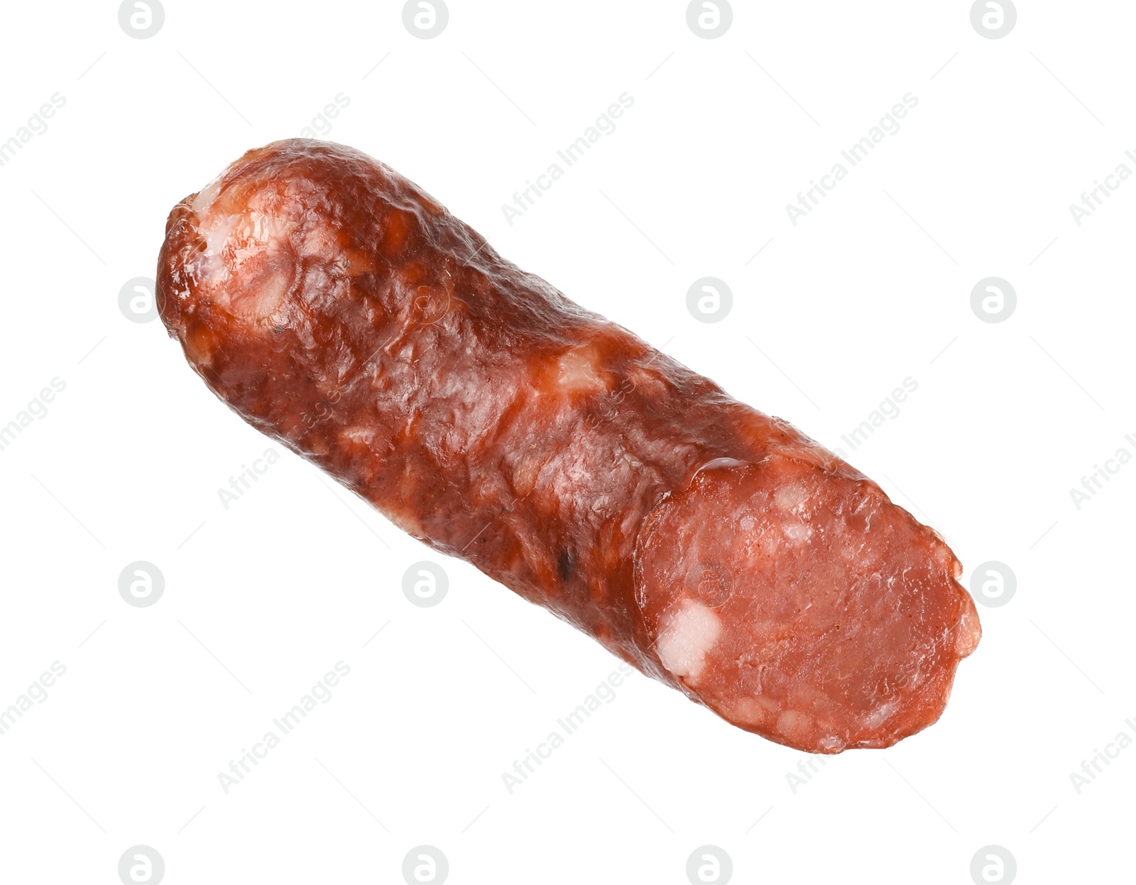 Photo of Piece of thin dry smoked sausage isolated on white