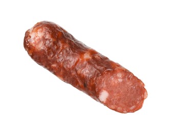 Photo of Piece of thin dry smoked sausage isolated on white