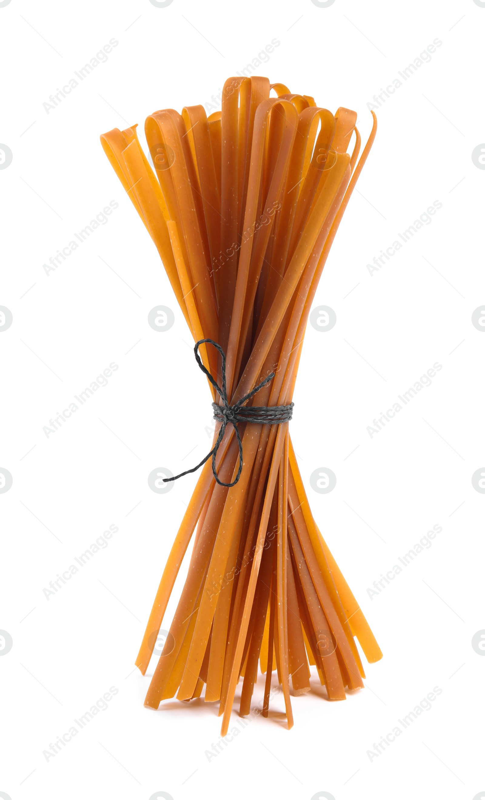 Photo of Tied uncooked buckwheat noodles isolated on white