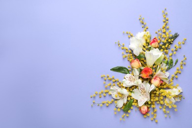 Photo of Beautiful floral composition with mimosa flowers on light blue background, flat lay. Space for text