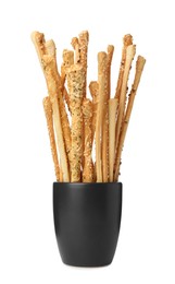 Photo of Delicious grissini sticks in cup on white background