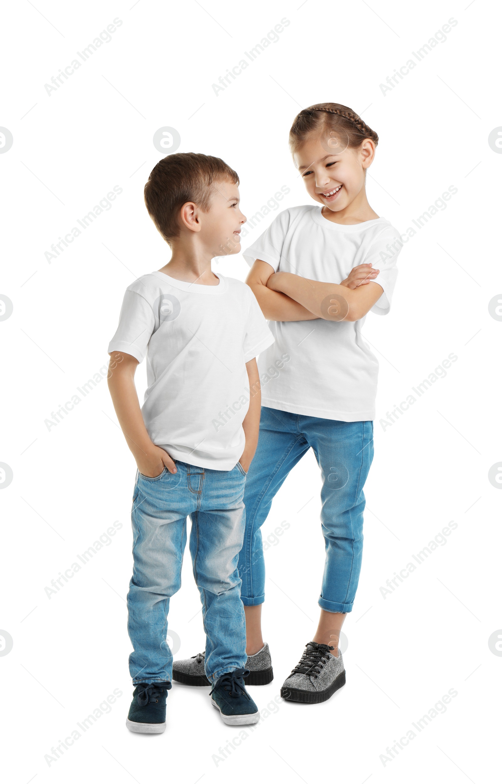 Photo of Little kids in t-shirts on white background. Mockup for design