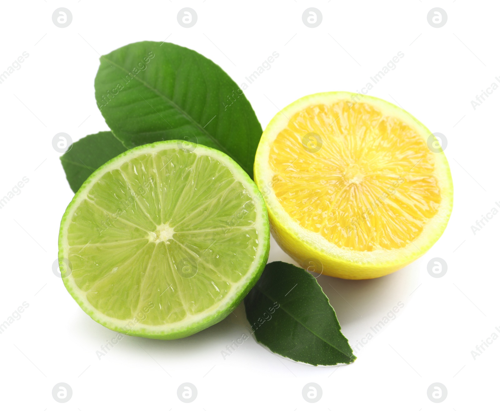 Photo of Halves of fresh ripe lemon, lime and green leaves on white background