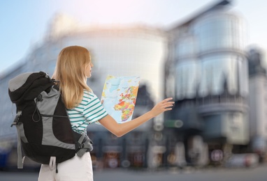 Traveler with map in foreign city. Summer vacation trip