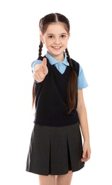 Photo of Portrait of cute girl in school uniform on white background
