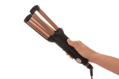 Woman holding modern triple curling iron on white background, closeup