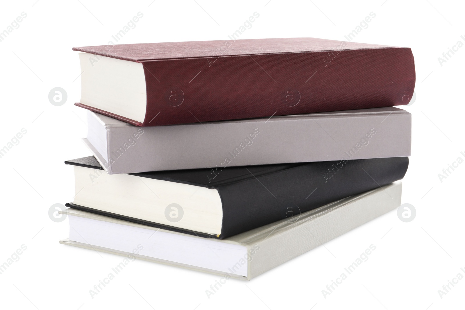 Photo of Many different books stacked on white background