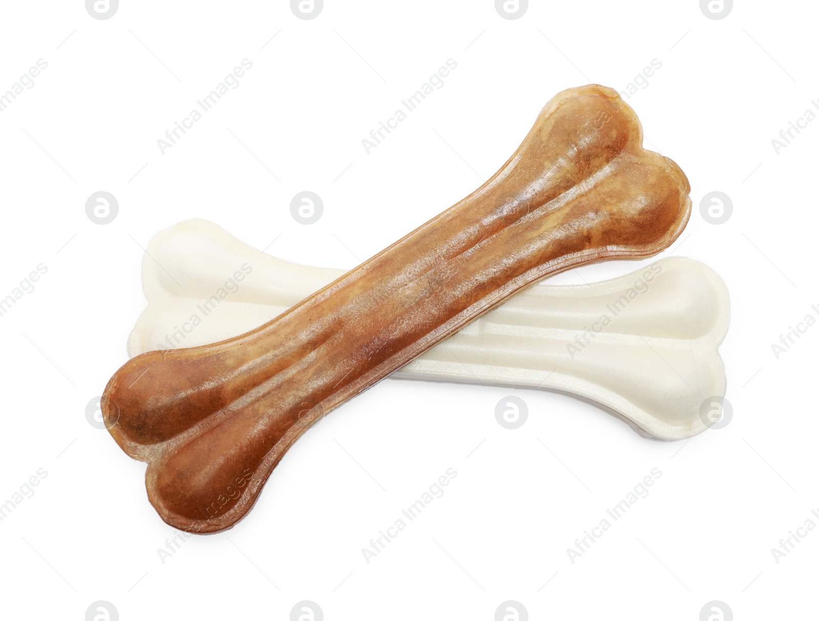 Photo of Different bone dog treats isolated on white, above view