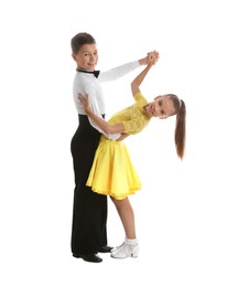 Beautifully dressed couple of kids dancing on white background