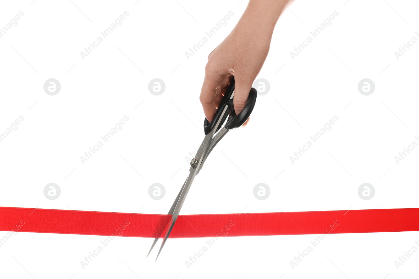 Photo of Woman cutting red ribbon with scissors on white background. Traditional ceremony