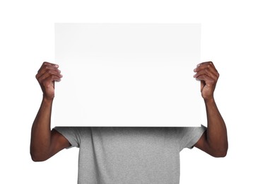 Photo of African American man holding sheet of paper on white background. Mockup for design