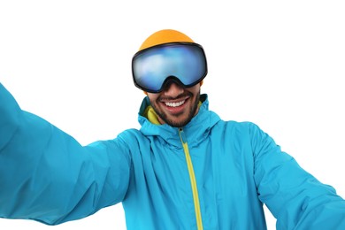 Photo of Smiling young man in ski goggles taking selfie on white background