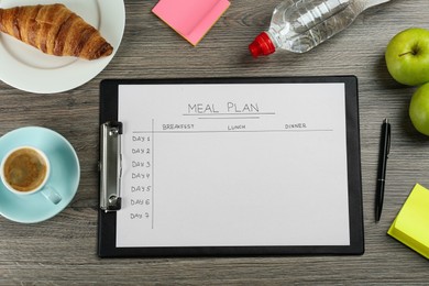 Photo of Flat lay composition of clipboard with Meal Plan on wooden table