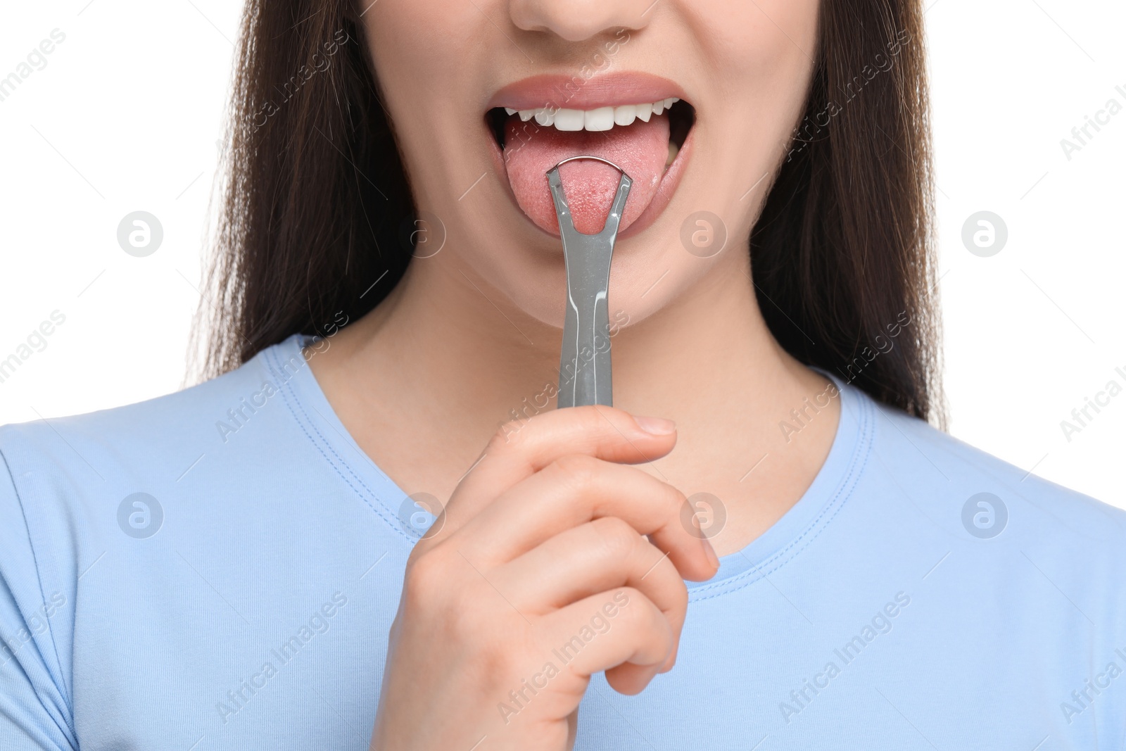 Photo of Woman brushing her tongue with cleaner on white background, closeup