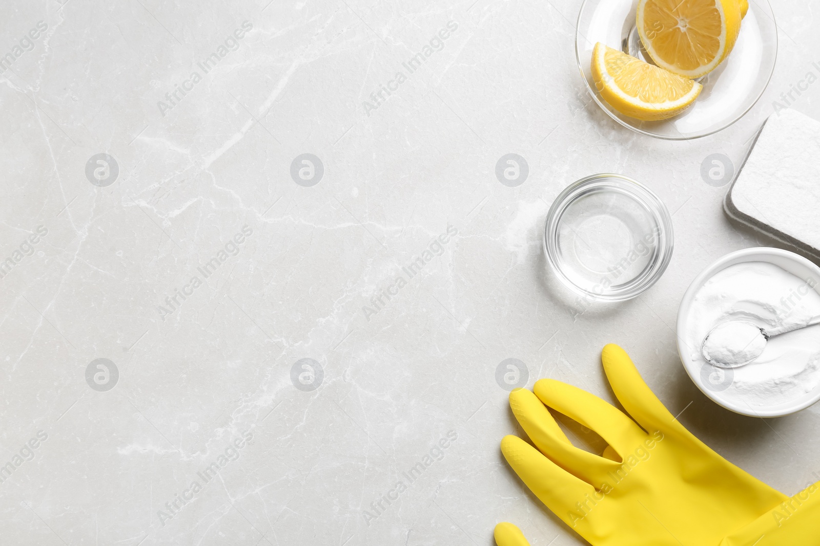 Photo of Flat lay composition with baking soda on light grey table. Space for text