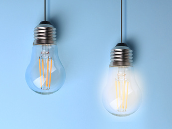 Image of Idea concept. Light bulbs on light blue background