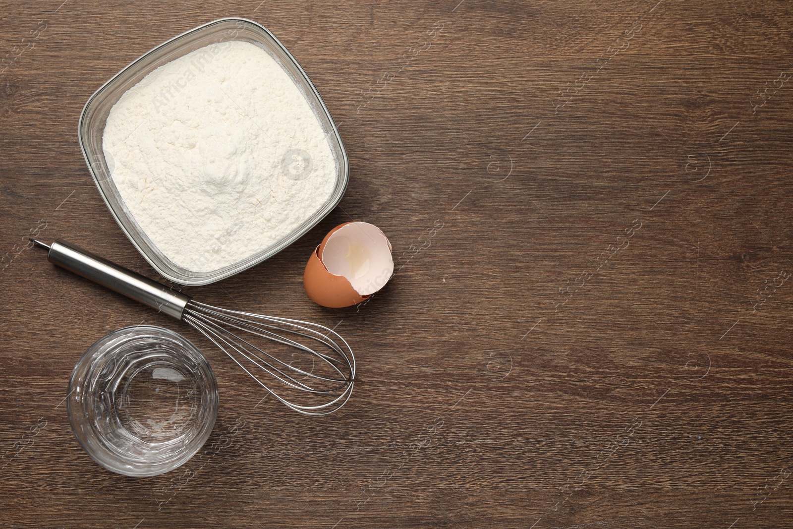 Photo of Cooking scones with soda water. Ingredients for dough on wooden table, flat lay and space for text