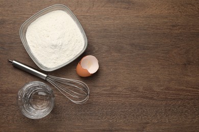 Photo of Cooking scones with soda water. Ingredients for dough on wooden table, flat lay and space for text