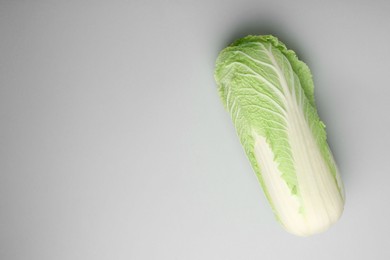 Fresh ripe Chinese cabbage on grey background, top view. Space for text