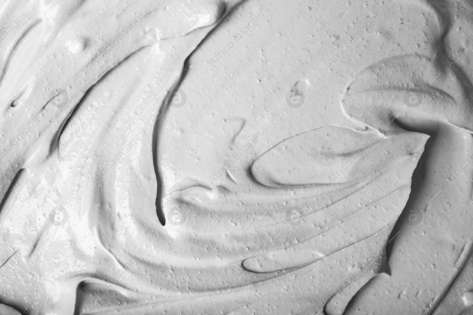 Photo of Texture of light gray professional face mask as background, closeup