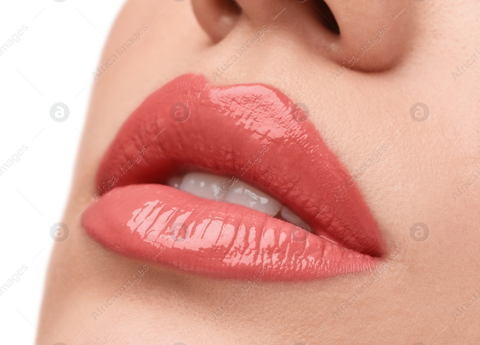 Photo of Woman applying lip gloss on white background, closeup