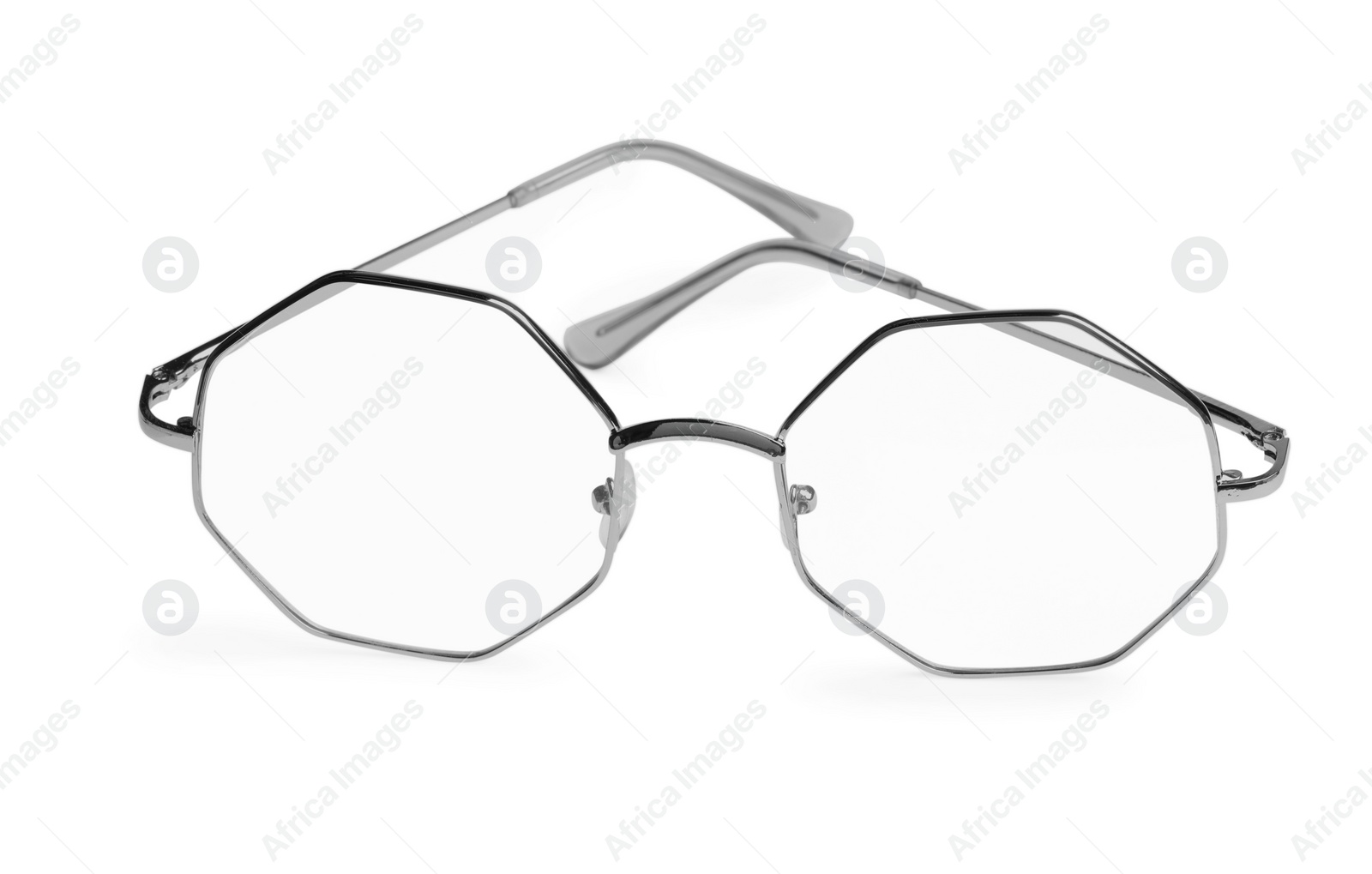 Photo of Stylish glasses with metal frame isolated on white