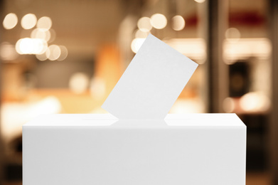 Image of Ballot box with vote indoors. Election time