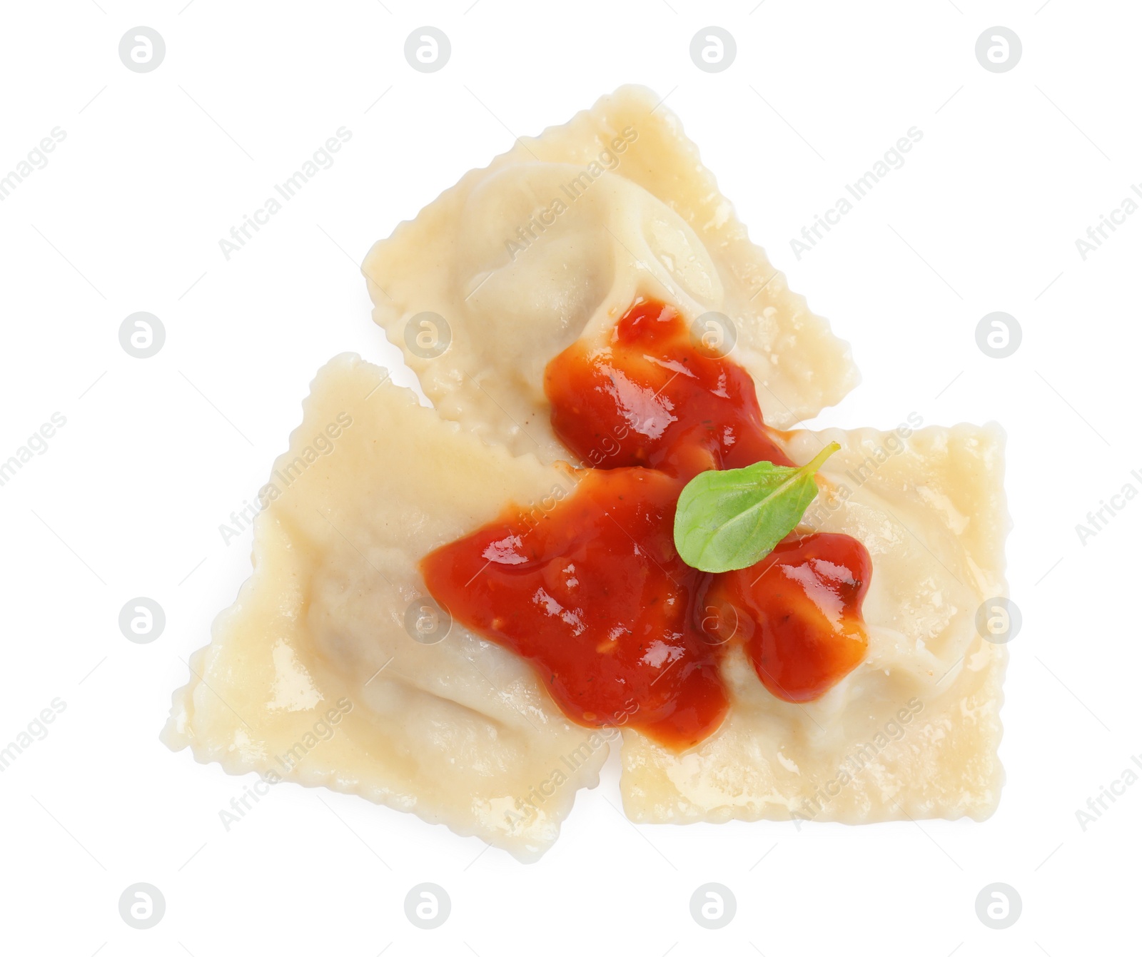 Photo of Tasty ravioli with tomato sauce on white background, top view