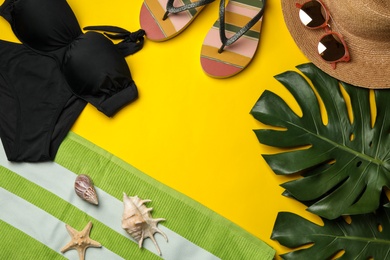 Photo of Flat lay composition with beach accessories on color background. Space for text