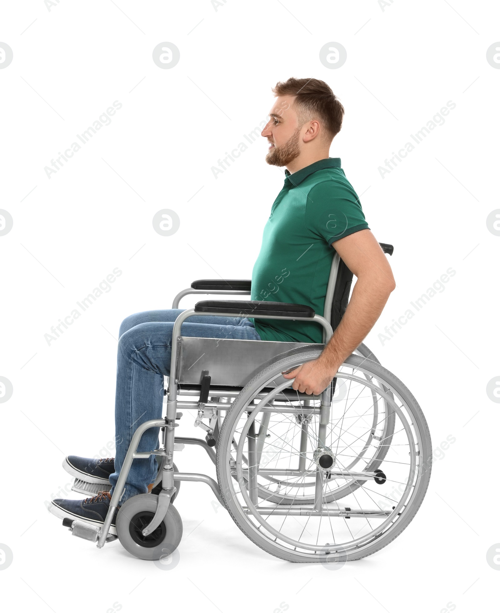 Photo of Handsome young man in wheelchair isolated on white