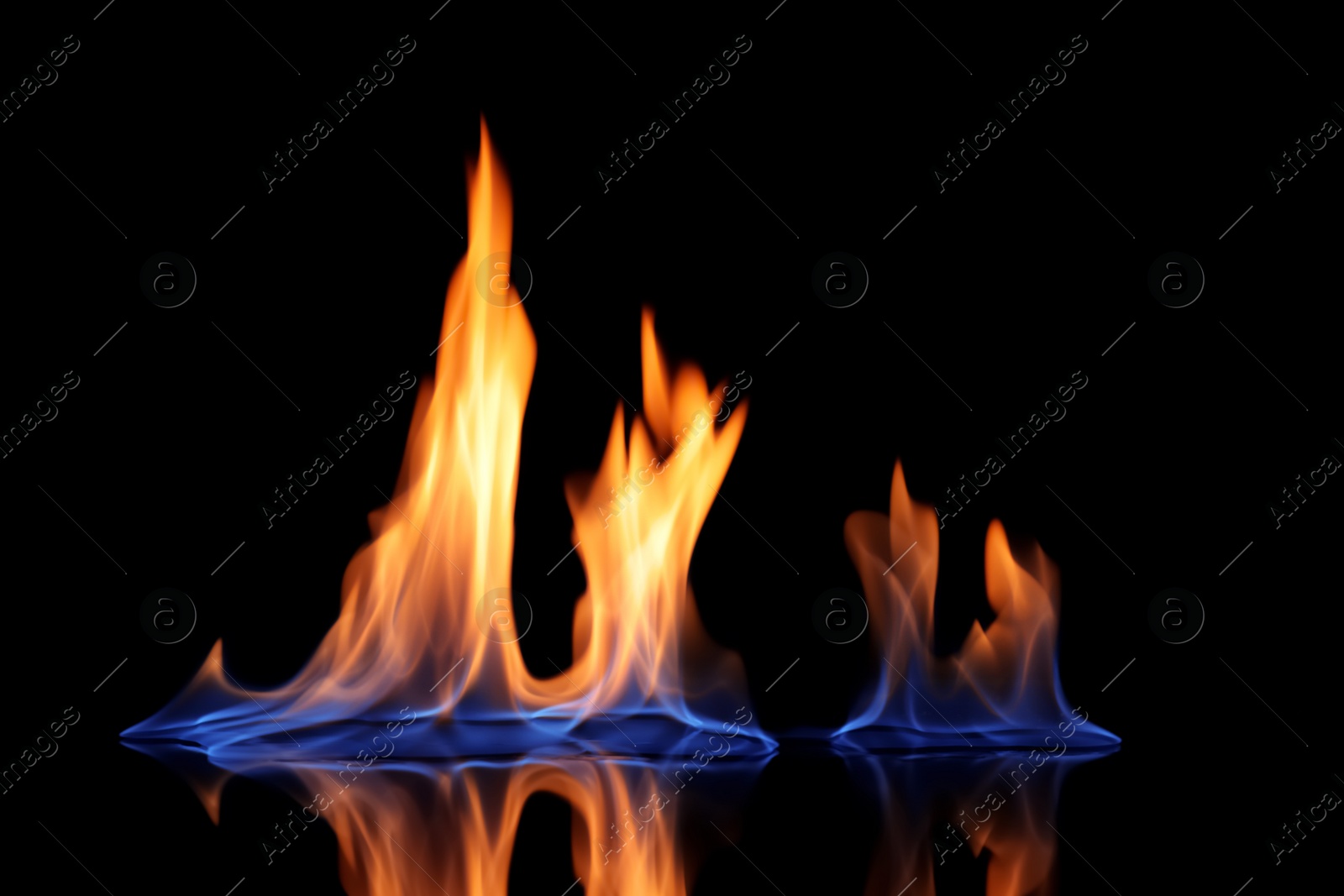 Photo of Beautiful view of flaming vodka on black background