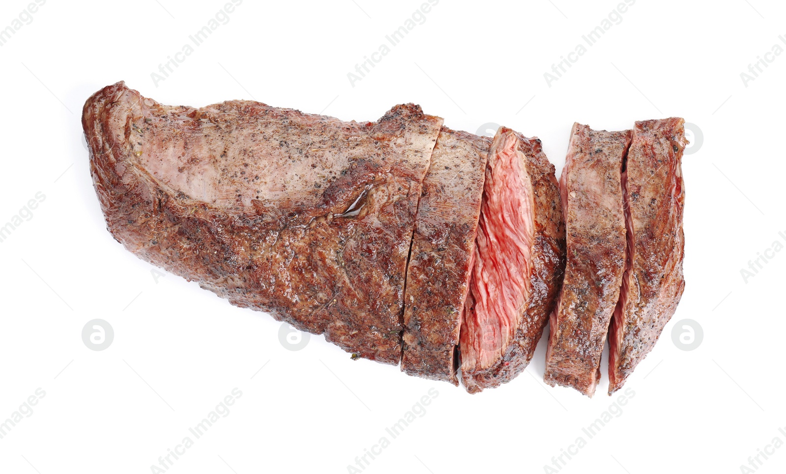 Photo of Pieces of tasty grilled beef meat isolated on white, top view