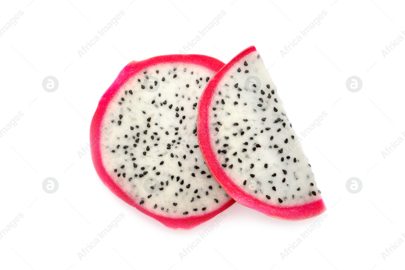 Photo of Slices of delicious ripe dragon fruit (pitahaya) on white background, top view