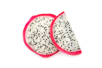 Photo of Slices of delicious ripe dragon fruit (pitahaya) on white background, top view