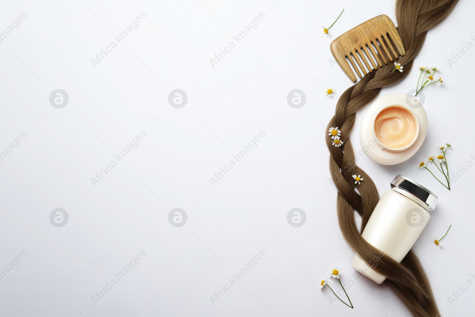 Photo of Flat lay composition with natural cosmetic products and hair braid on white background. Space for text