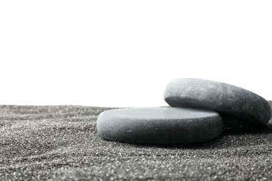 Photo of Presentation of product. Stone podiums on black sand against white background