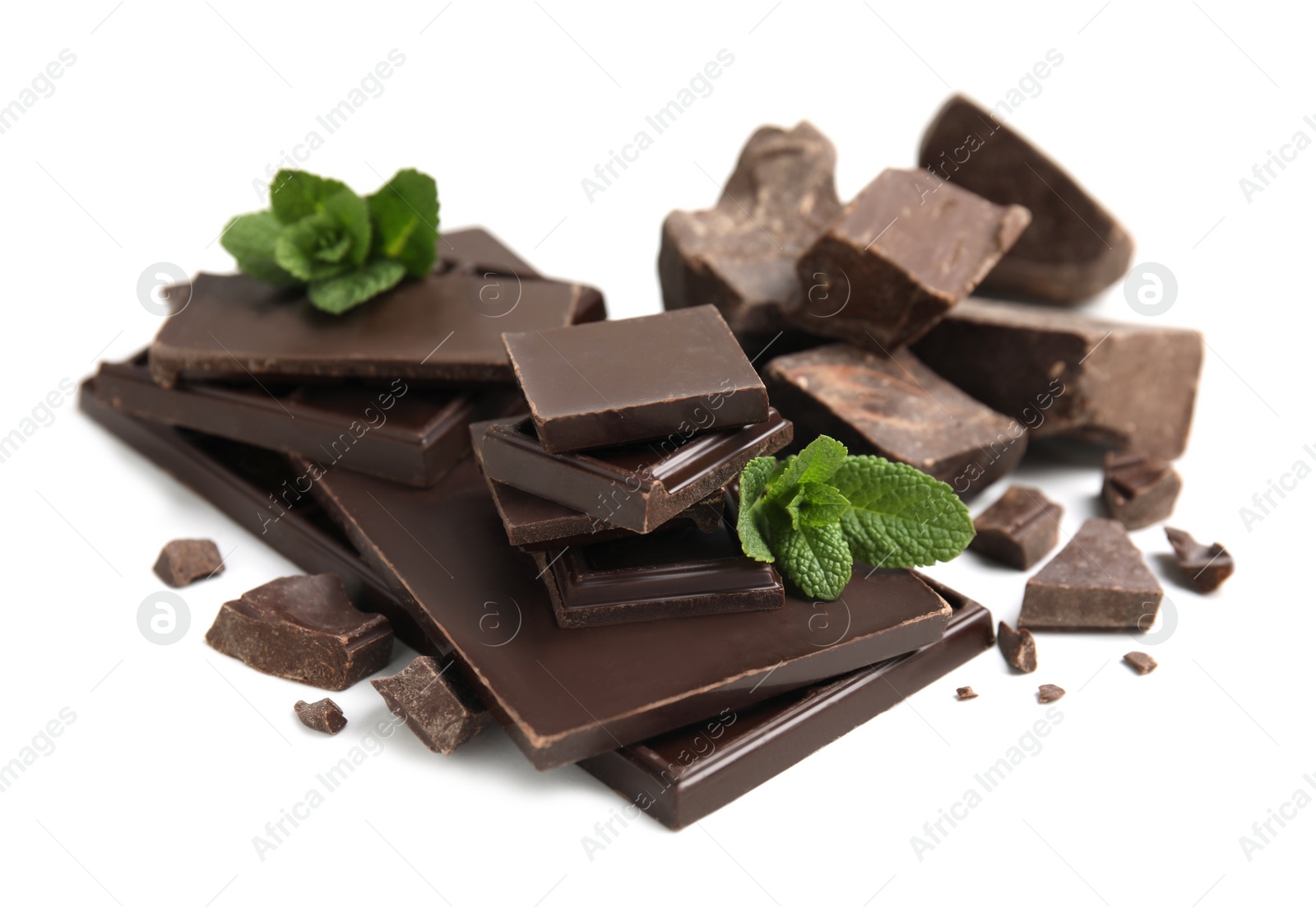 Photo of Tasty dark chocolate pieces with mint on white background