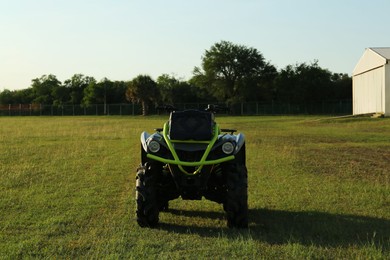 Photo of Modern quad bike in field on sunny day