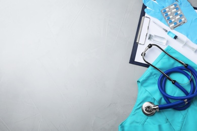 Photo of Flat lay composition with medical objects and space for text on grey background