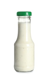 Photo of Delicious sauce in glass bottle on white background