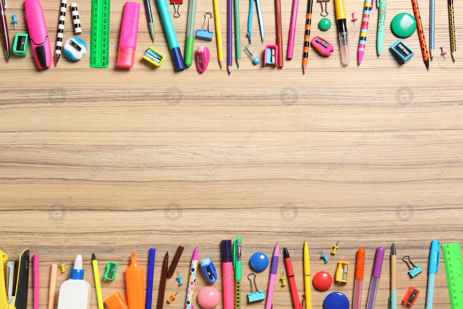 Photo of Flat lay composition with different stationeries on wooden background, space for text