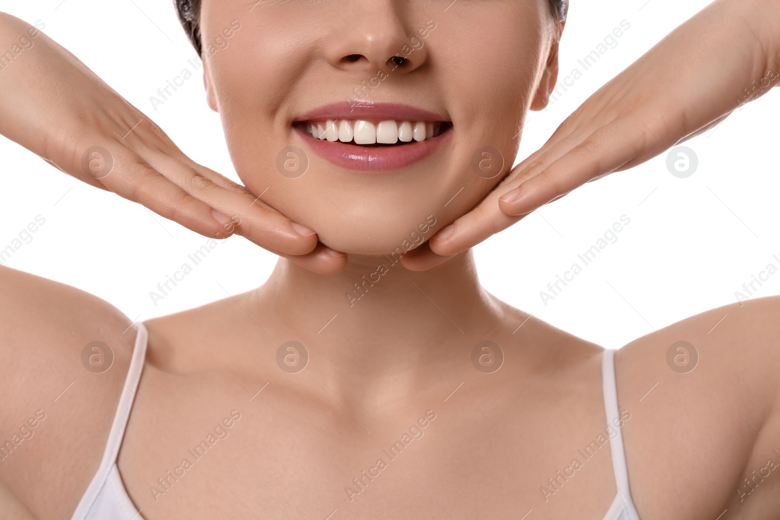 Photo of Young woman massaging her face on white background, closeup