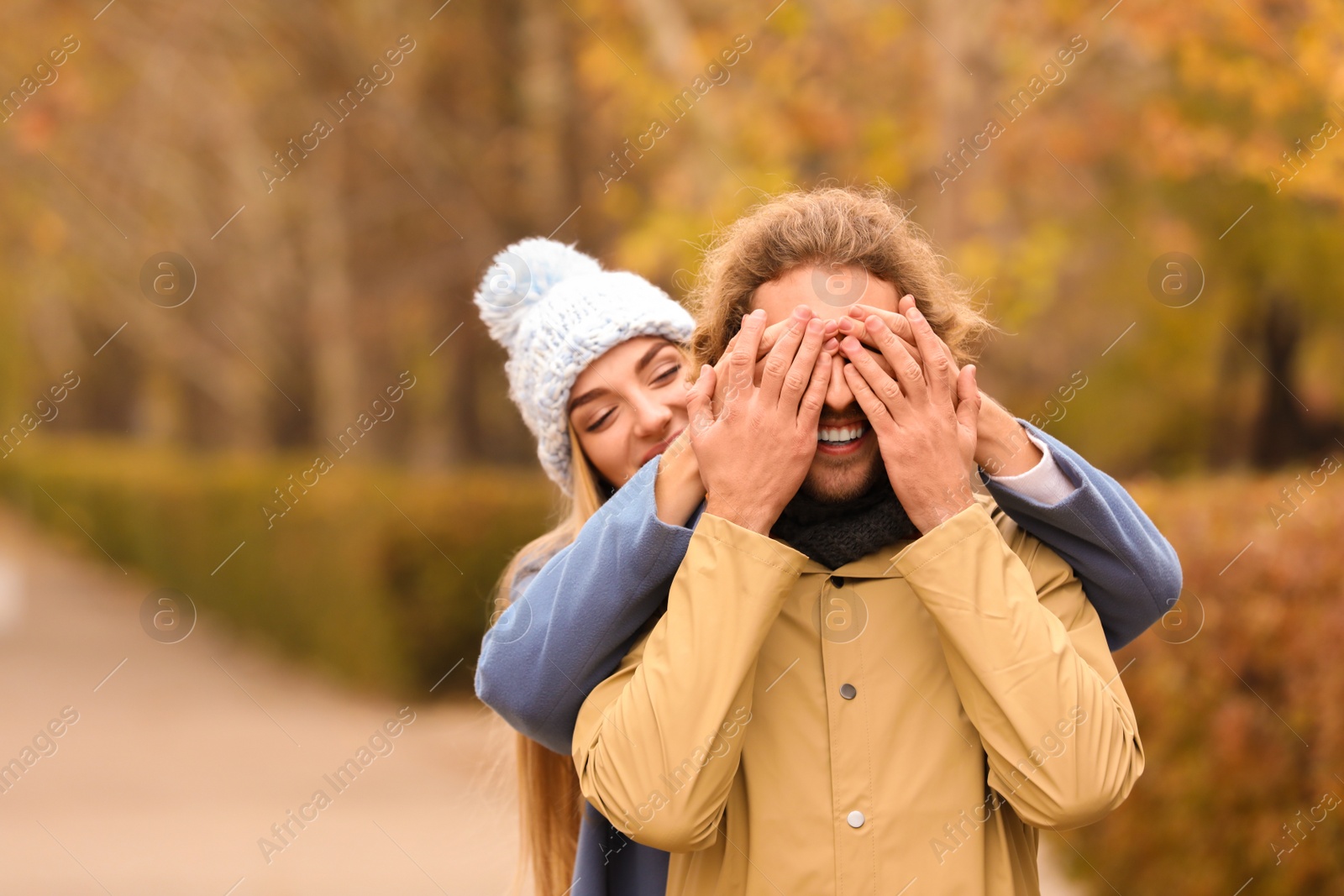 Photo of Young romantic couple having fun in park on autumn day