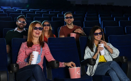 Photo of Young people watching movie in cinema theatre