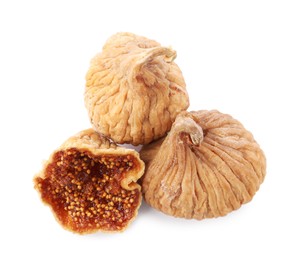 Many tasty dried figs isolated on white