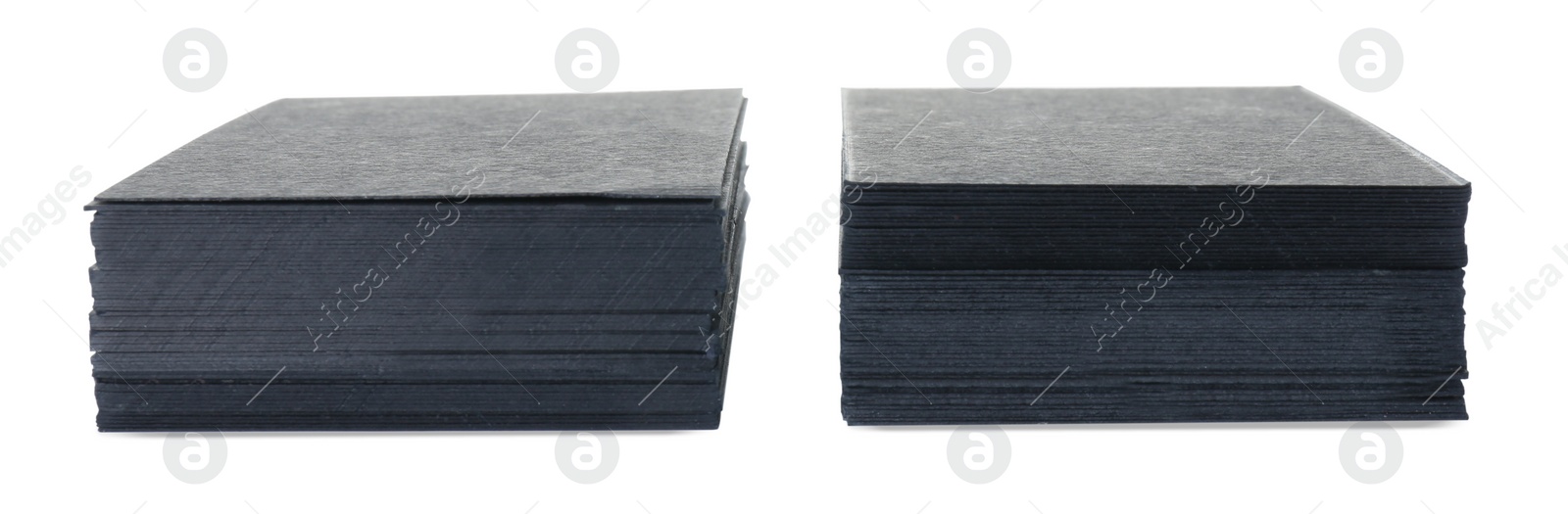 Photo of Stacks of blank black business cards isolated on white