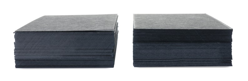 Stacks of blank black business cards isolated on white