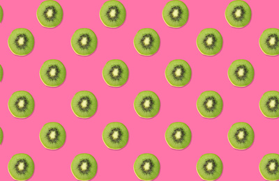 Image of Pattern of kiwi halves on pink background