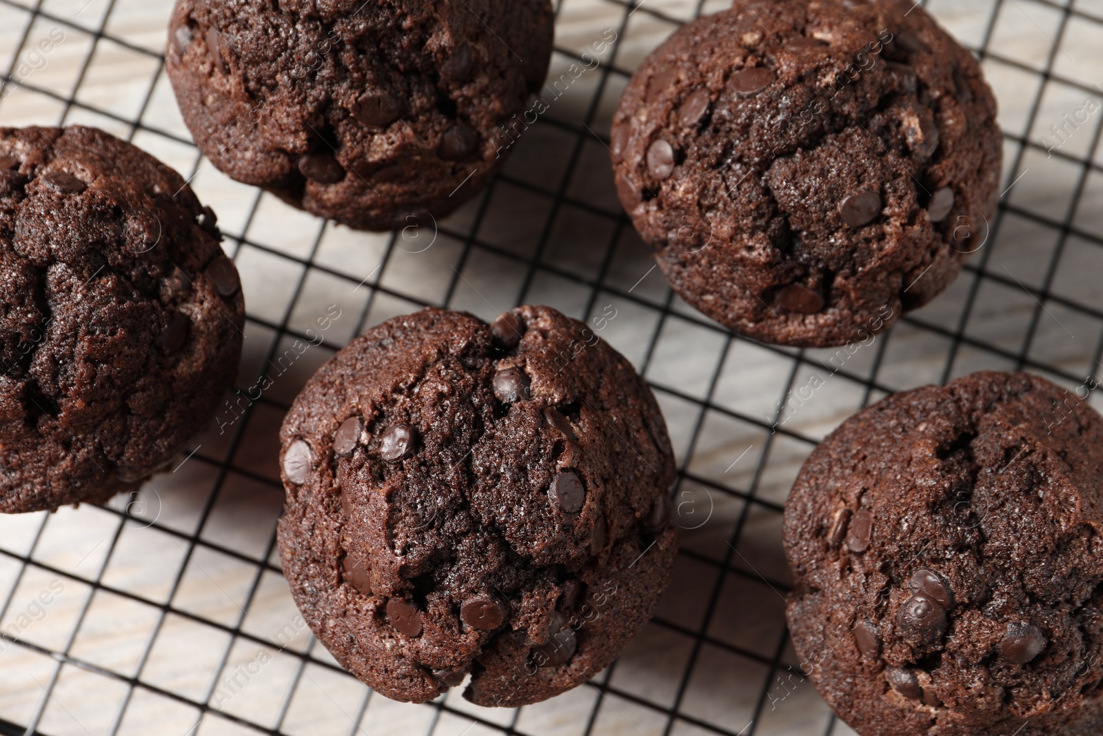 Photo of Delicious chocolate muffins on table, top view