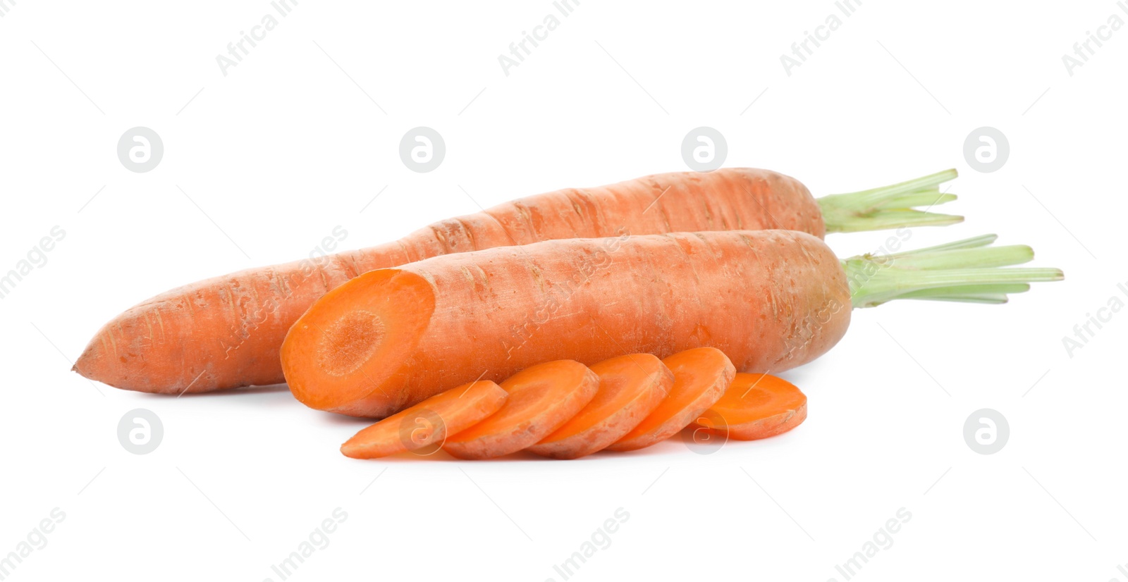 Photo of Tasty ripe organic carrots on white background